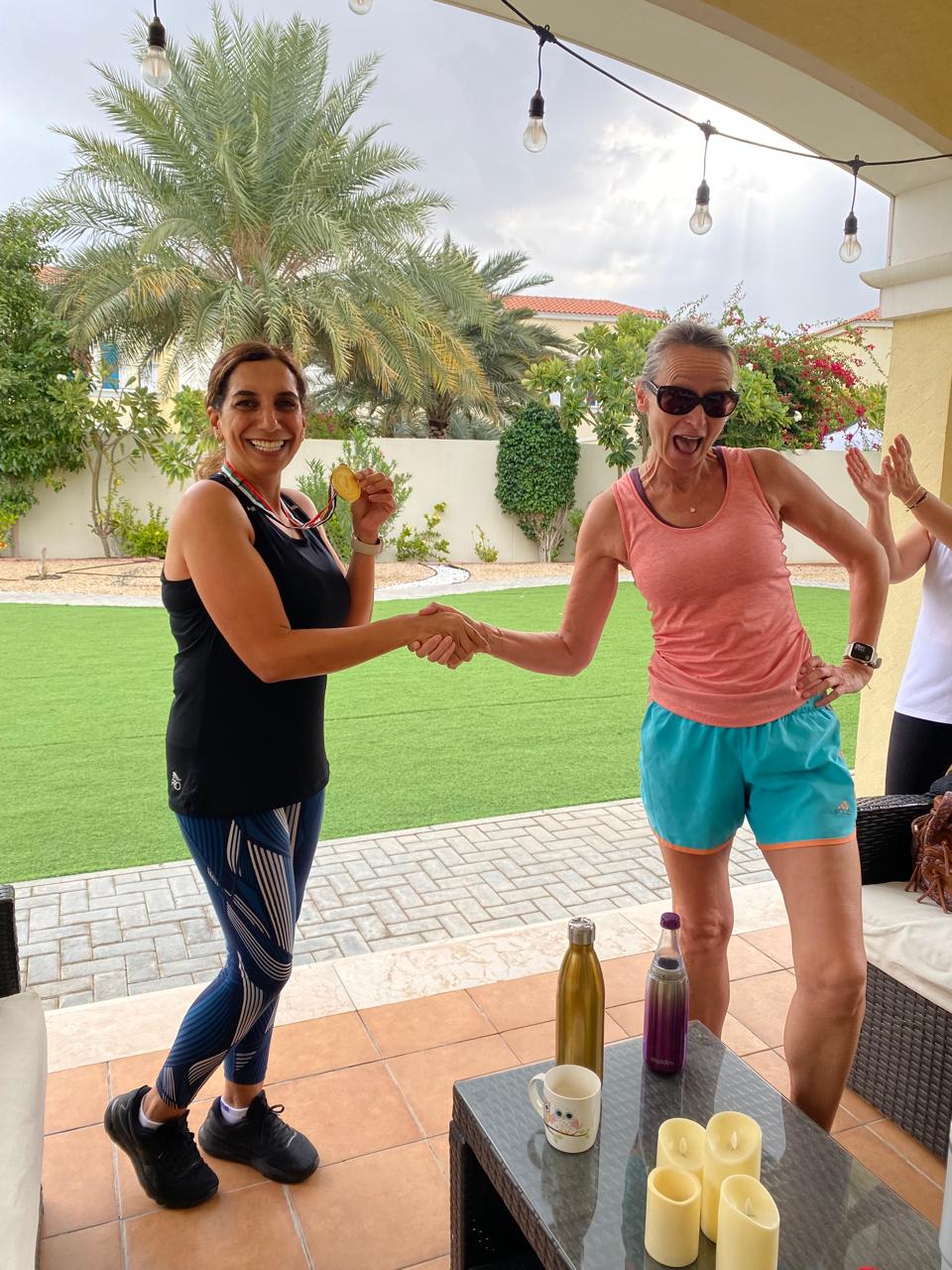 Celebrating a client's race medal